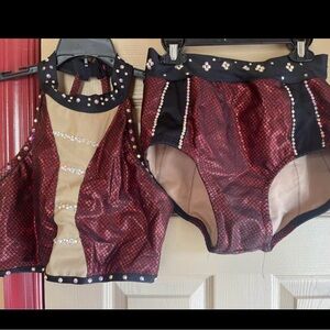 Beautiful custom dance costume. Lots of stones. Sparkly on stage.